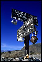 Tea kettle Junction sign, adorned with tea kettles. Death Valley National Park, California, USA.