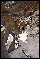 Hikers in slot, Mosaic canyon. Death Valley National Park, California, USA. (color)