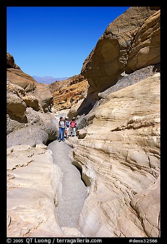 Hikers in narrows, Mosaic canyon. Death Valley National Park, California, USA.