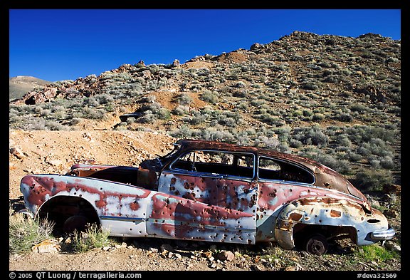 Car with bullet holes near Aguereberry camp, afternoon. Death Valley National Park, California, USA.