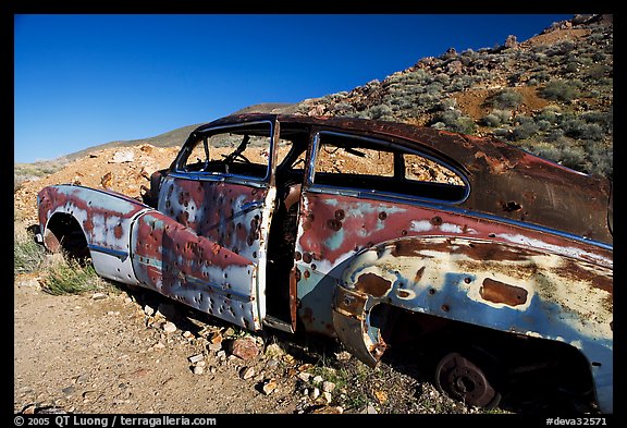 Car with bullet holes near Aguereberry camp, afternoon. Death Valley National Park, California, USA.