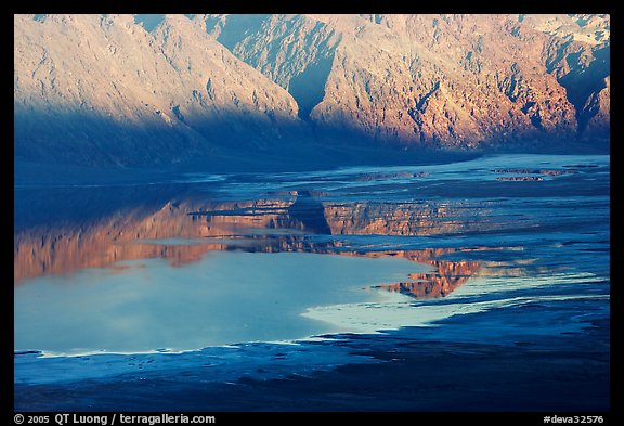 Reflections in Manly Lake at Badwater, seen from Aguereberry point, late afternoon. Death Valley National Park, California, USA.