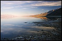 Flooded Badwater basin and Black mountain reflections, early morning. Death Valley National Park ( color)