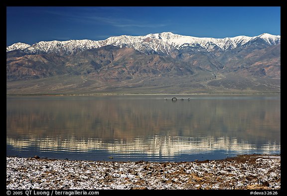 Panamint Range, salt formations, and Manly Lake with Loch Ness Monster. Death Valley National Park, California, USA.