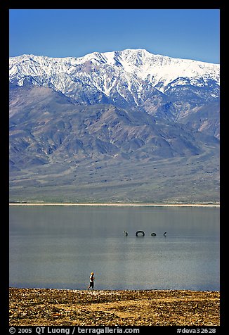 Tourist, ephemeral Loch Ness Monster in Manly Lake, and Telescope Peak. Death Valley National Park, California, USA.