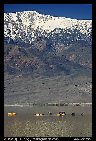 Kayakers near the Loch Ness Monster in Manly Lake, below Telescope Peak. Death Valley National Park, California, USA.