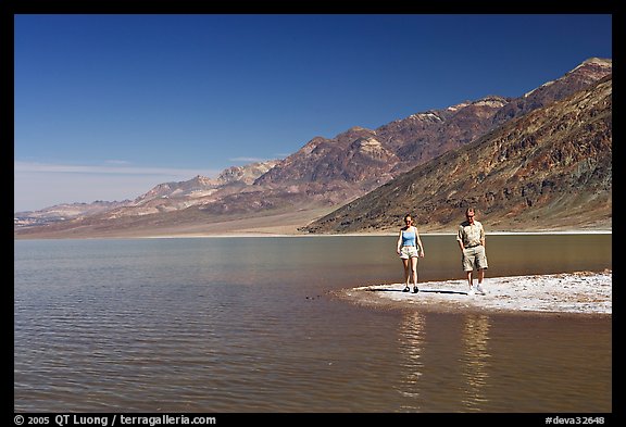 Couple on the shores of Manly Lake. Death Valley National Park, California, USA.