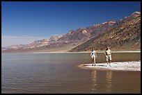 Couple on the shores of Manly Lake. Death Valley National Park, California, USA. (color)