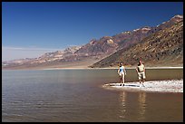 Couple on the shores of Manly Lake. Death Valley National Park, California, USA.