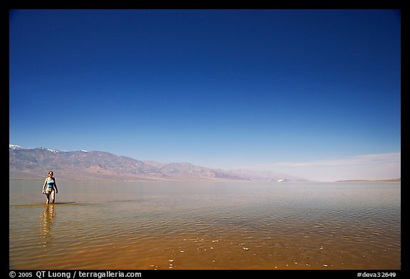 Woman wading in Manly Lake. Death Valley National Park (color)