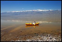 Kayaker near shore in Manly Lake. Death Valley National Park, California, USA. (color)