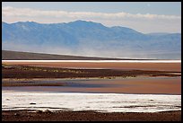 Salt Flats on Valley floor and Owlshead Mountains, early morning. Death Valley National Park, California, USA.