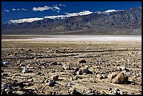 Rock field, salt flats, and Panamint Range, morning. Death Valley National Park, California, USA. (color)