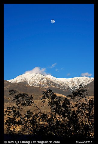 Moon and Panamint Range seen from the West. Death Valley National Park, California, USA.