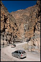 Cars in narrows, Titus Canyon. Death Valley National Park, California, USA. (color)