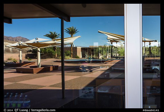 Patio, oasis and mountains, Furnace Creek Visitor Center window reflexion. Death Valley National Park (color)
