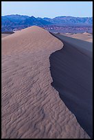 Dune ridge and Amargosa Range at dusk. Death Valley National Park ( color)