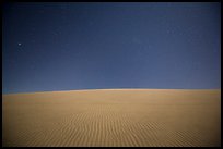 Dune ripples and starry sky. Death Valley National Park, California, USA.