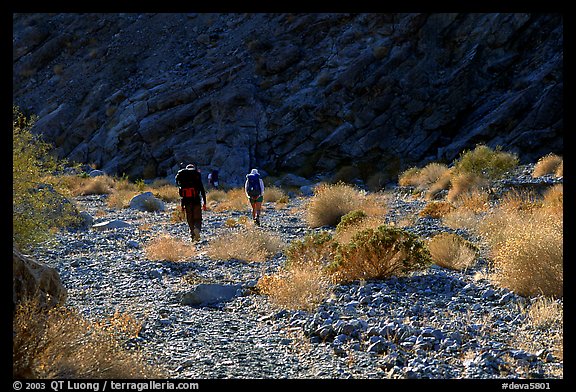 Hikers in a side canyon. Death Valley National Park, California, USA.