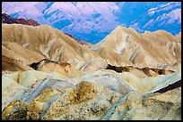 Badlands and mountain lighted by sunrise, Twenty Mule Team Canyon. Death Valley National Park ( color)