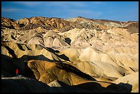 Visitor looking, Twenty Mule Team Canyon. Death Valley National Park, California, USA.