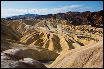 Visitor looking, Zabriskie Point. Death Valley National Park, California, USA.