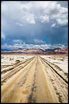 Straight road through Salt Pan. Death Valley National Park, California, USA.