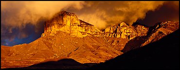Cliffs and clouds illuminated by low sun. Guadalupe Mountains National Park (Panoramic color)