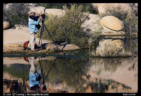 Photographer with large format camera at Barker Dam. Joshua Tree National Park, California, USA.