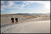 Backpackers hiking on Backcountry Trail in late afternoon. White Sands National Park ( color)