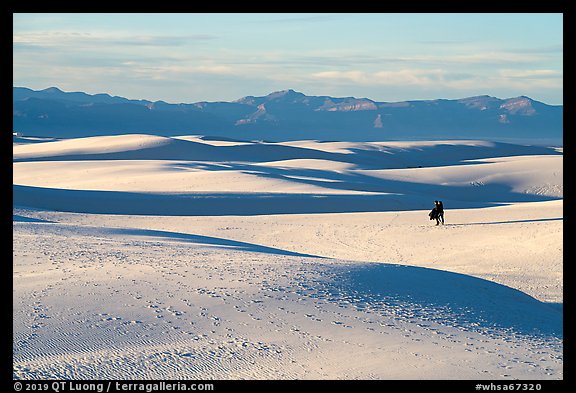 Couple hiking on dunes. White Sands National Park (color)