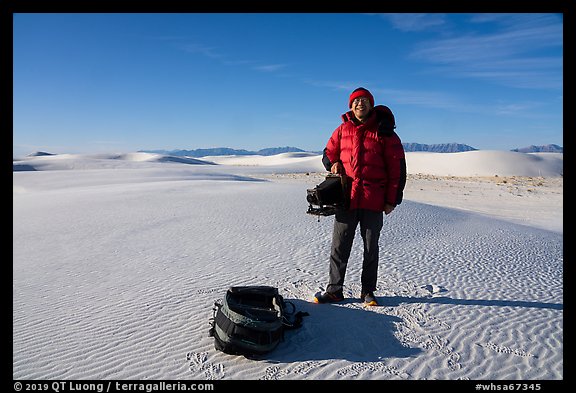Photographer holding large format camera. White Sands National Park (color)