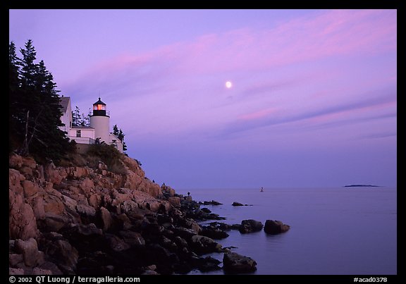 Bass Harbor lighthouse on rocky coast, sunset. Acadia National Park, Maine, USA.