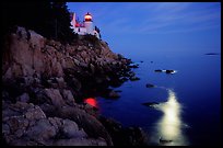 Bass Harbor lighthouse by night with moon reflection in ocean. Acadia National Park ( color)