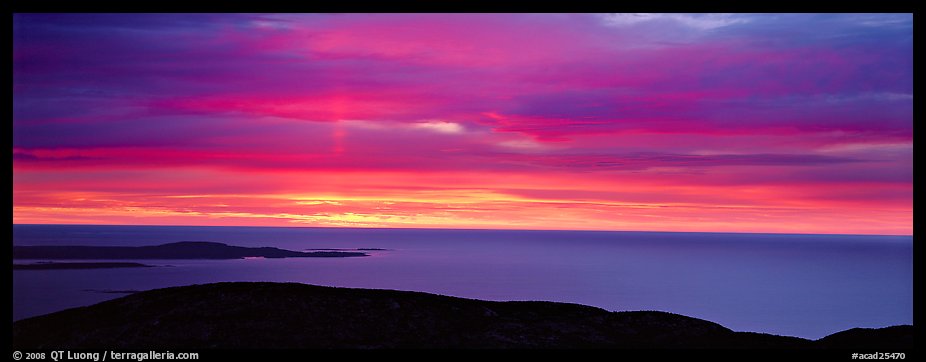 Red clouds over ocean at sunrise. Acadia National Park, Maine, USA.