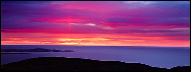 Red clouds over ocean at sunrise. Acadia National Park, Maine, USA.