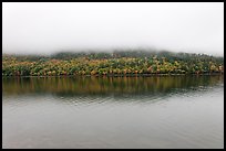 Hill reflected in Jordan Pond with top covered by fog. Acadia National Park, Maine, USA. (color)
