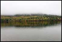 Hill reflected in Jordan Pond with top covered by fog. Acadia National Park, Maine, USA. (color)