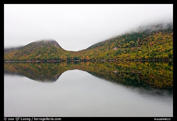 Hills, reflections, and fog in autumn, Jordan Pond. Acadia National Park, Maine, USA.