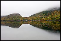 Hills, reflections, and fog in autumn, Jordan Pond. Acadia National Park, Maine, USA. (color)