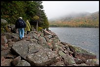 Hikers on shore of Jordan Pond. Acadia National Park, Maine, USA.