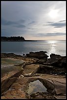 Rock slabs and sun over ocean, Schoodic Peninsula. Acadia National Park, Maine, USA. (color)