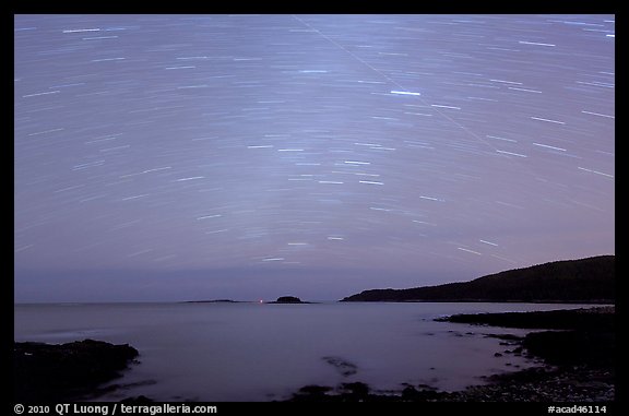 Star trails above coast, Schoodic Peninsula. Acadia National Park, Maine, USA.