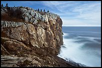 Sea cliff and blurred ocean water. Acadia National Park, Maine, USA.