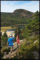 Hikers above Sand Beach. Acadia National Park, Maine, USA. (color)