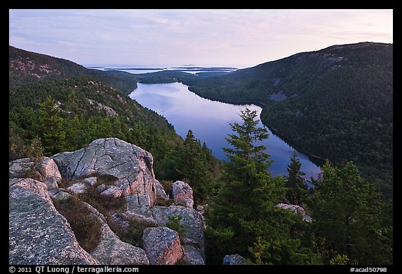 Forested hills and Jordan pond from above at dusk. Acadia National Park, Maine, USA.