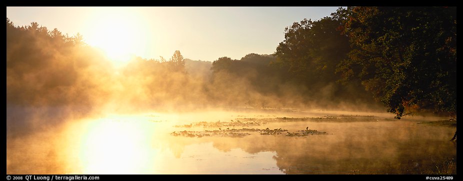 Sun rising above misty lake at dawn. Cuyahoga Valley National Park (color)
