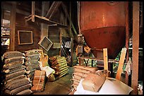 Grain distributor and bags of  seeds in Wilson feed mill. Cuyahoga Valley National Park, Ohio, USA. (color)