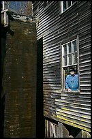 Miller standing at window, Mingus Mill, North Carolina. Great Smoky Mountains National Park, USA.