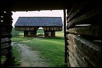 Cantilever barn framed by doorway, Cades Cove, Tennessee. Great Smoky Mountains National Park, USA.